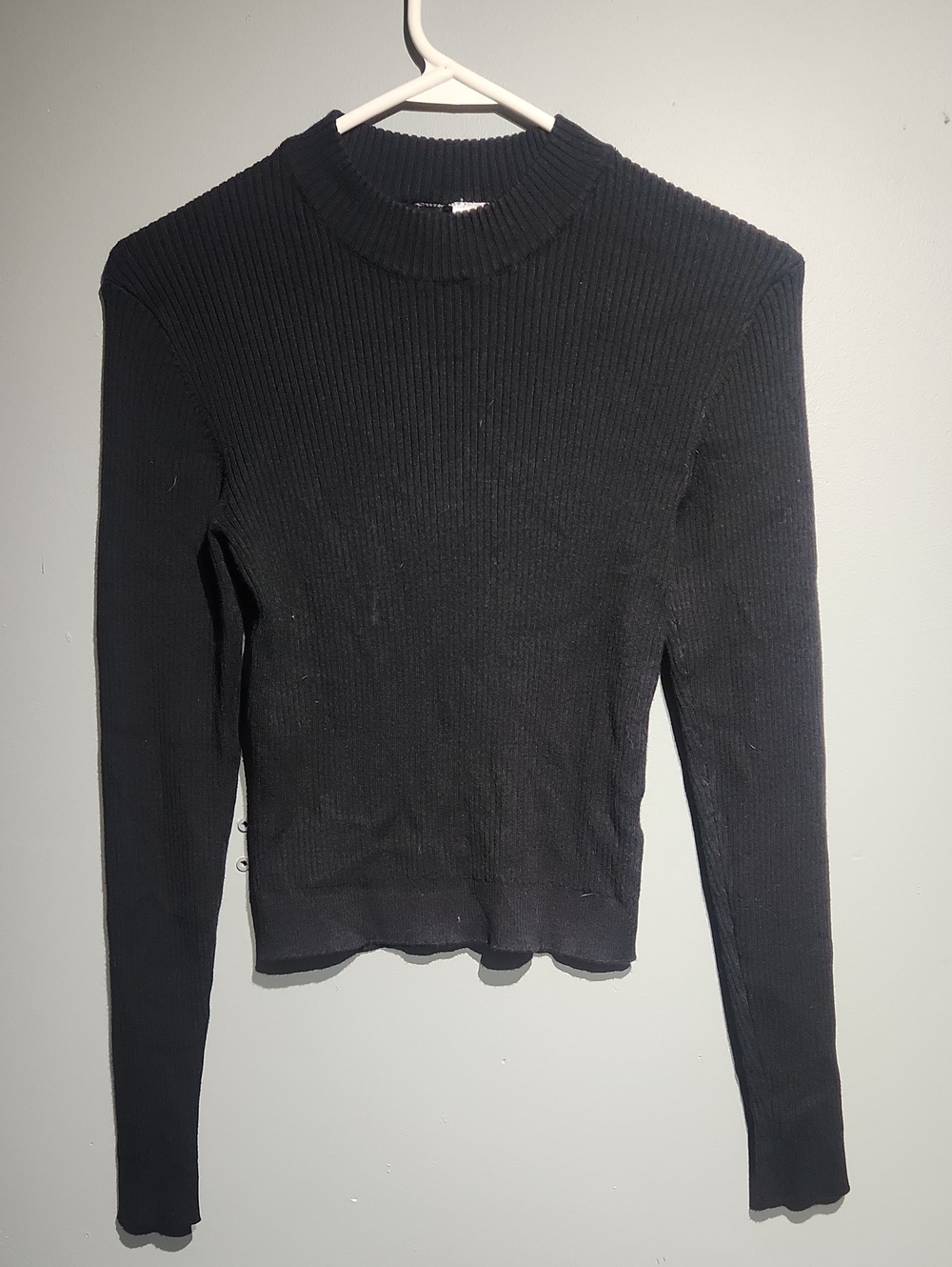 Divided by H&M top is a black ribbed knit sz small